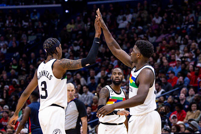 Dec 28, 2022; New Orleans, Louisiana, USA; Minnesota Timberwolves guard Anthony Edwards (1) and forward Jaden McDaniels (3) high five on a time out against the New Orleans Pelicans during the second half at Smoothie King Center.